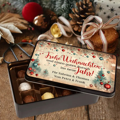 Geschenkdose mit Pralinen personalisiert mit Wunschtext „Frohe Weihnachten und ein guten Rutsch ins neue Jahr“