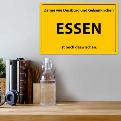 Blechschild "Zähne wie Duisburg und Gelsenkirchen. Essen ist noch dazwischen."